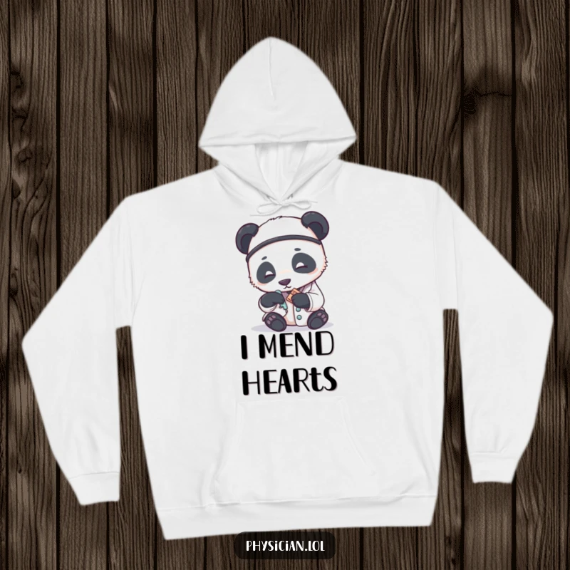 Funny hoodie showing a panda doctor applying a small bandage with great care, offering cozy warmth and humorous empathy.