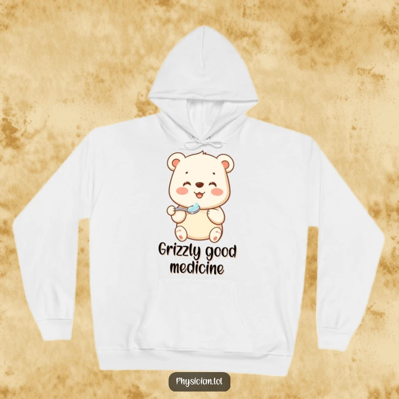 Funny bear medicine hoodie showing a beaming bear holding a spoonful of medicine with grace, perfect for cozy comfort.