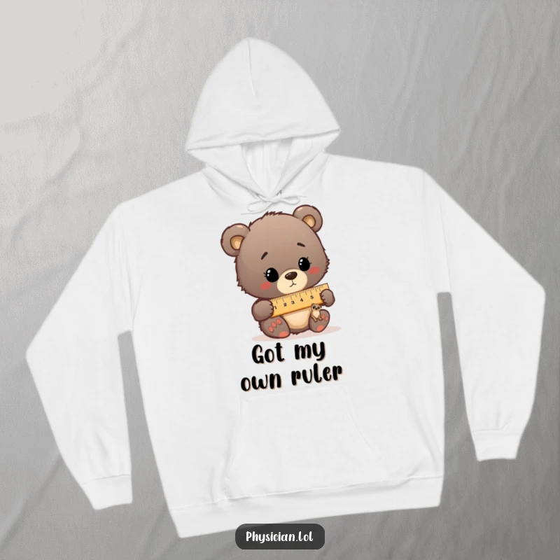 Funny bear cub doctor humorously measuring a small patient with a comically large ruler, printed on a cozy hoodie.